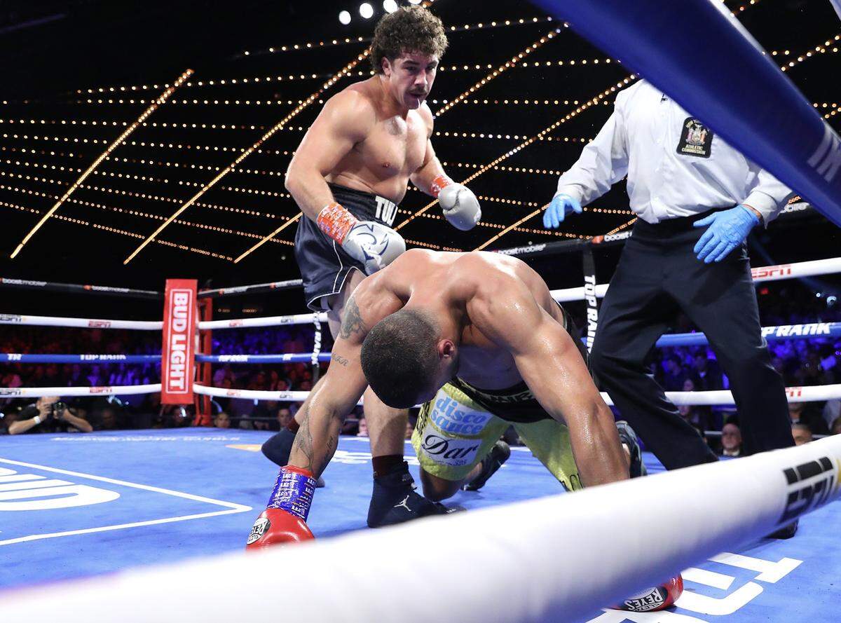 Richard Torrez Jr., left, knocks-down Ahmed Hefny, right, during their heavyweight fight at The Hulu Theater at Madison Square Garden on October 29, 2022 in New York City.