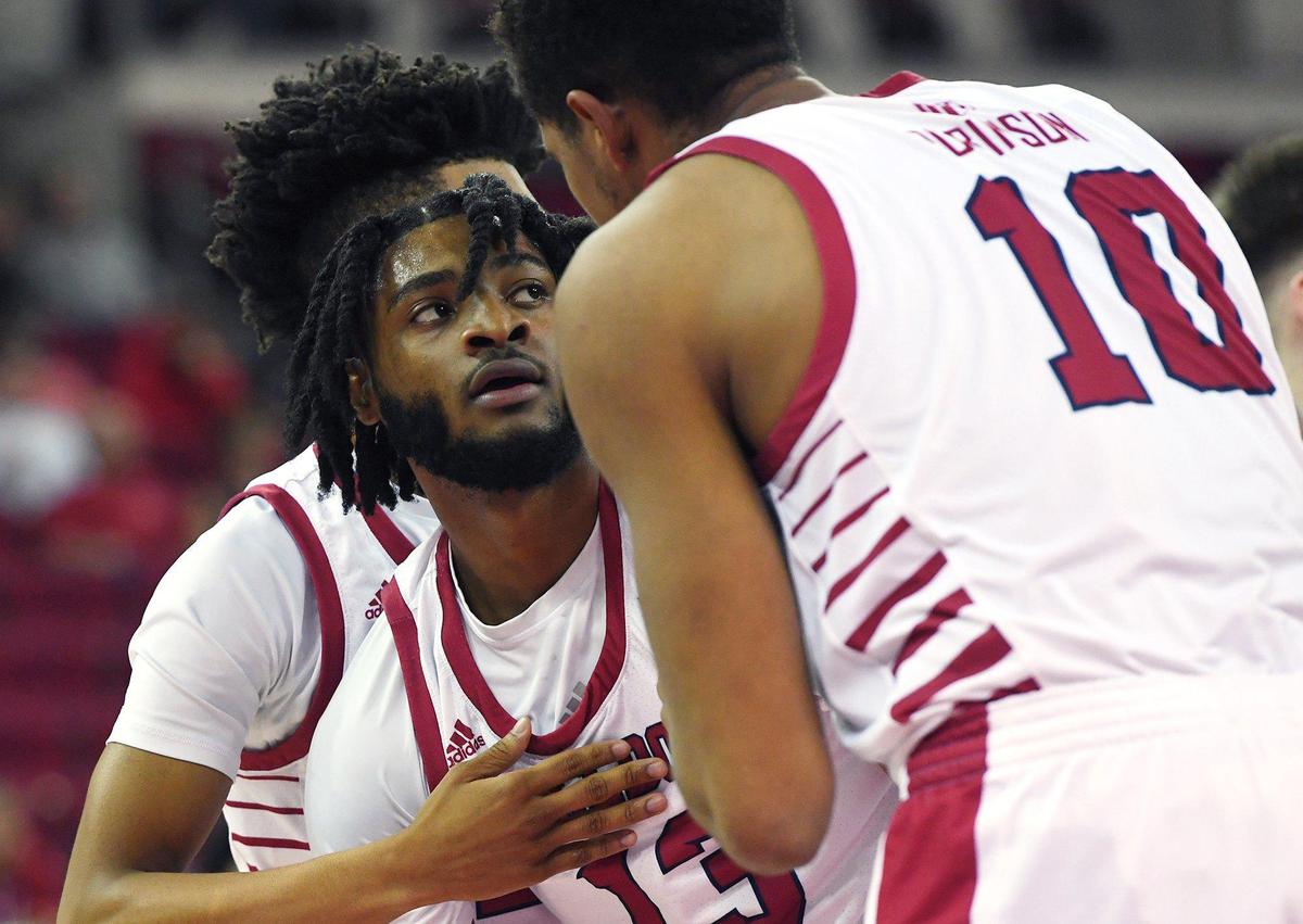 Fresno State’s Deon Stroud, left, listens toOrlando Robinson, right, as he picks himself off the floor in the game against Utah State Tuesday night, Jan. 18, 2022 in Fresno. Fresno State came from behind to defeat Utah State 61-54.