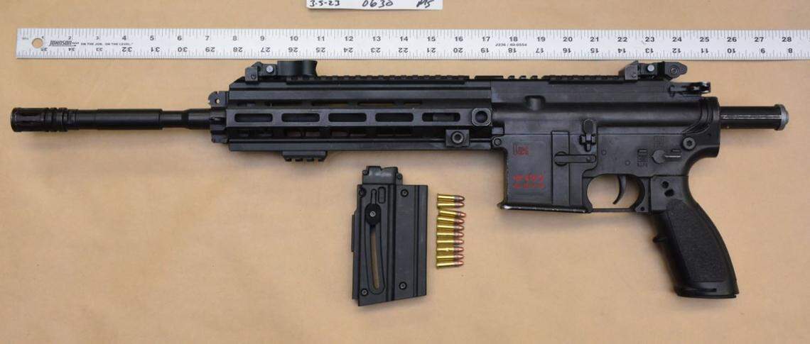 A carbine allegedly possessed by a gunman killed during an intense gun battle Saturday night near Herndon and Ingram avenues.