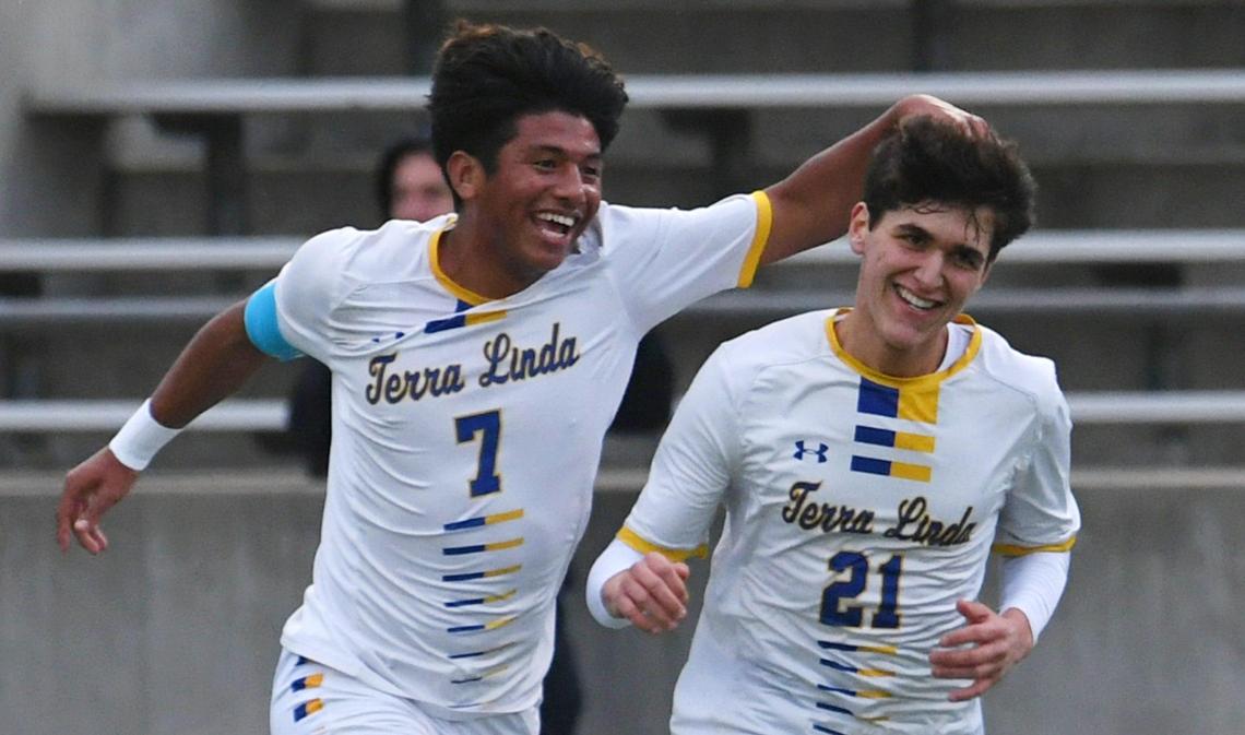 Terra Linda’s Kleber Maldonado, second from left, celebrates Francesco Calvi’s goal against McLane, second from right, in the CIF Northern California Regional Division III boys soccer championship Saturday, March 4, 2023 in Fresno. Terra Linda won the championship, 2-0.