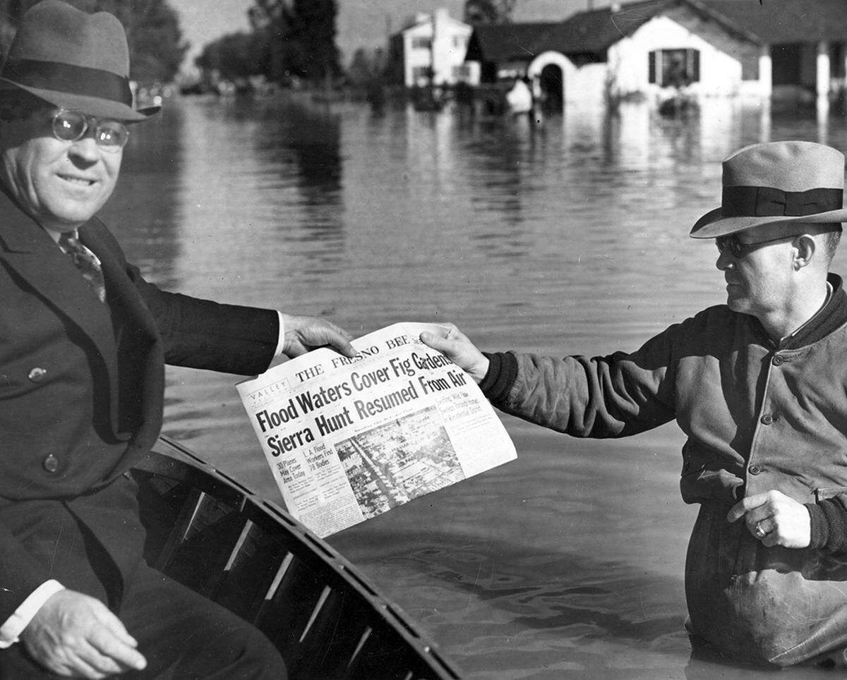 The Fresno Bee is delivered by boat in Fresno during a March 1938 flood.