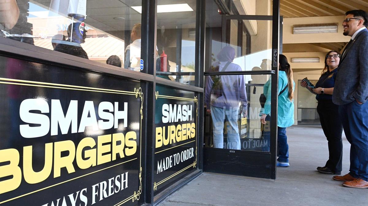 Customers wait to get into Sizzlin Smash Burgers during its grand opening in Madera in this Bee file photo from July 2025.