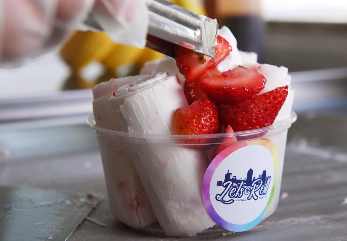 The last strawberry is placed on top of a La Nina Fresa by Tony Quezada Friday, Oct. 8, 2021 in Fresno. Quezada and Jasmin Guzman have opened Let’s Roll Fresno, a hand-rolled ice cream shop in the former Miller-Clark location on Olive Avenue near Fruit Ave. Photographed