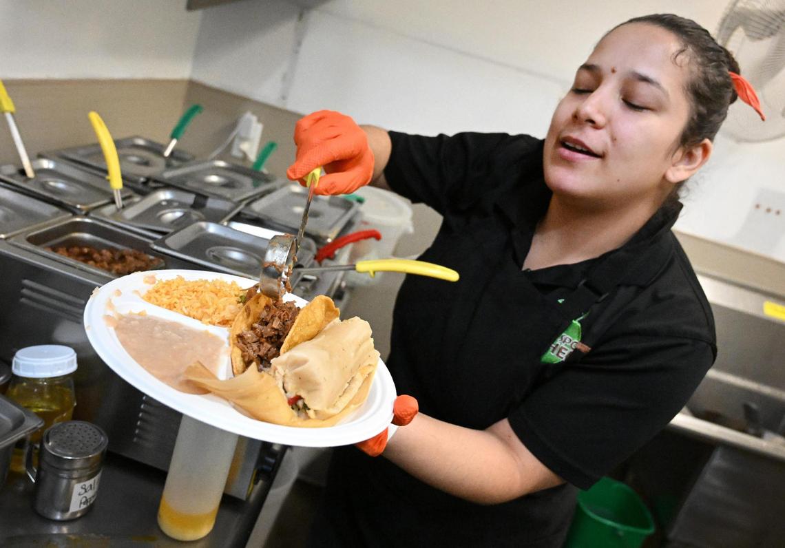 Chef and manager Fernanda Cox of La Jacka Restaurant prepares a vegan carne asada taco and tamale made from jackfruit at La Jacka Restaurant in downtown Fresno.