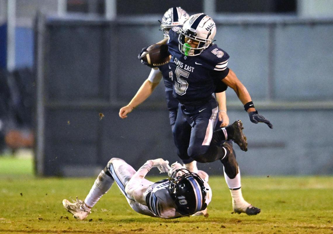 Clovis East’s Taemell Horton, top, jumps free of Clovis North’s Cannon Parks, bottom, Friday, Nov. 1, 2024. Clovis East beat Clovis North 38-21.