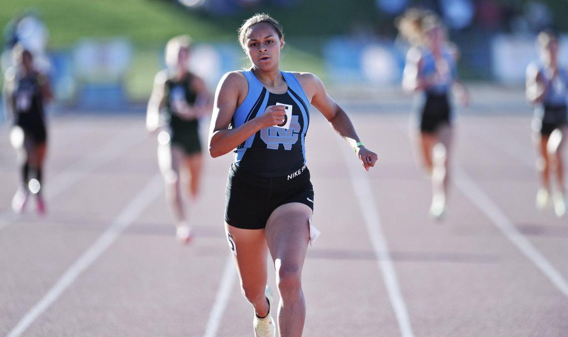 Clovis North’s Takiya Cenci, center, easily places first far ahead of the field in the 400 at the Central Section Masters held at Buchanan High School Saturday, May 21, 2022 in Clovis.
