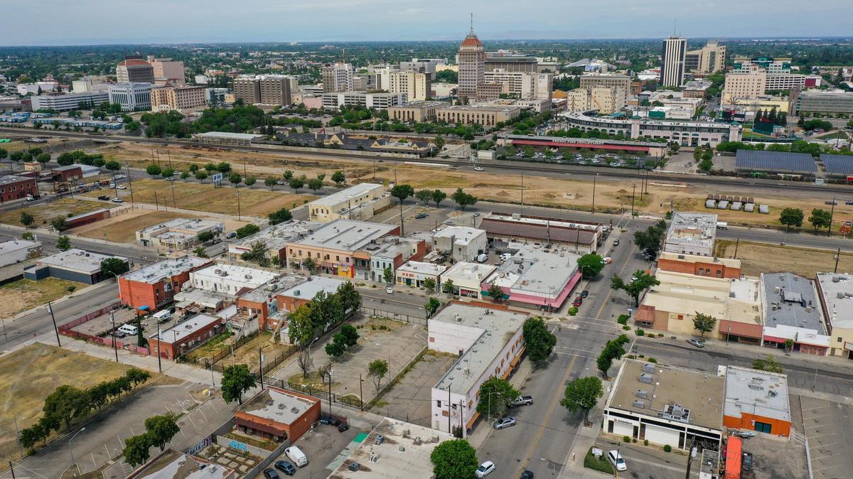 Chinatown lies in the foreground of this drone image, where high-speed rail contruction creates a barrier between it and downtown Fresno on Tuesday, April 28, 2020. Coronavirus orders have affected business in Chinatown already hit hard by high-speed rail construction road closures as well as the ongoing homeless problem.