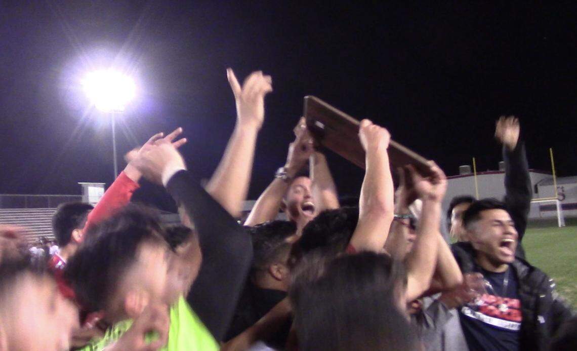 Sanger High celebrates its first Central Section title after a 4-1 victory over Dinuba in a Division II match on Friday, Feb. 21, 2020.