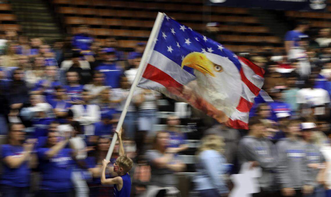 Immanuel High fan James Bartel, 8, was busy flying the school flag during his team’s 41-29 win over Mendota High in the CIF Central Section Division IV championship game at Selland Arena on Feb. 23, 2024.