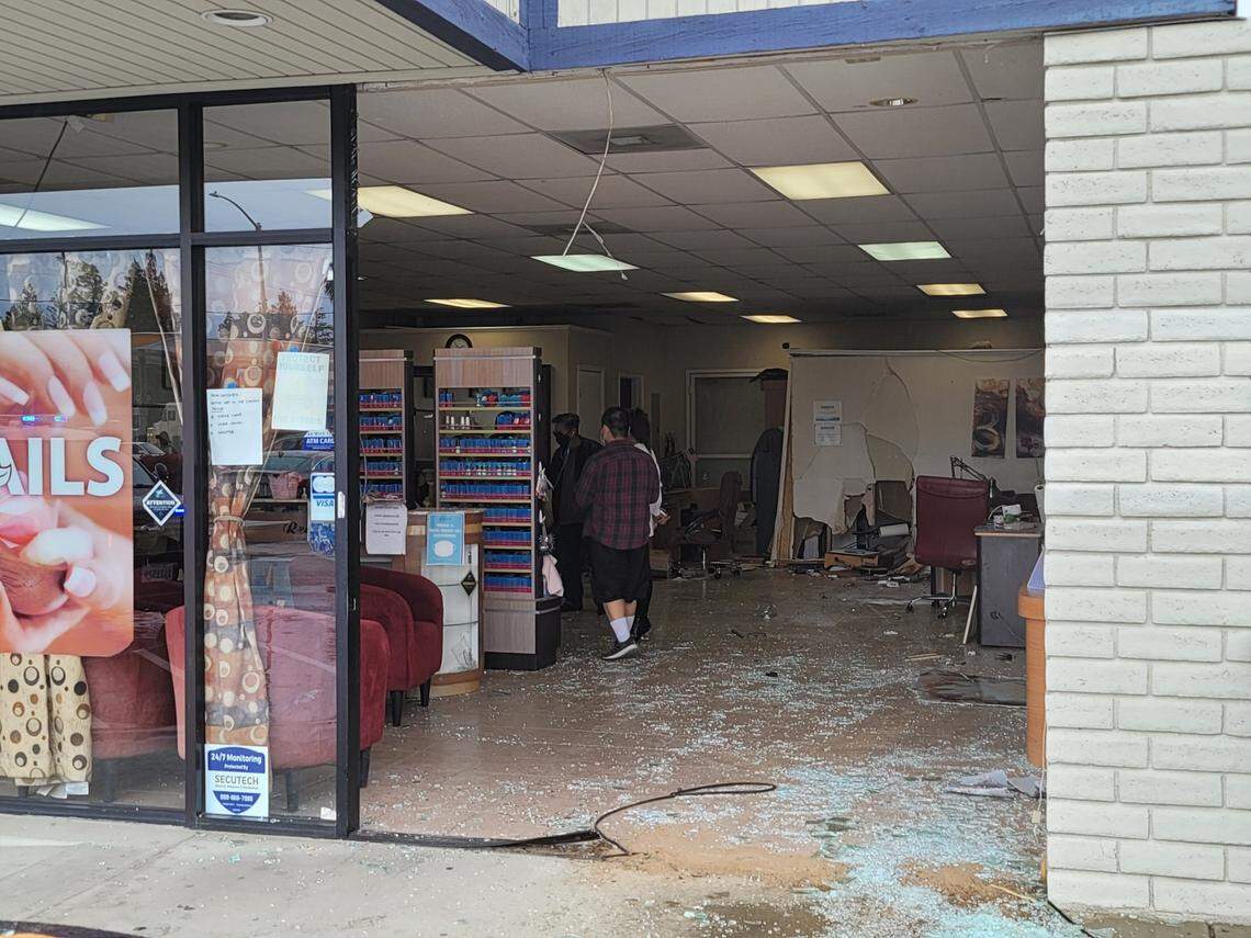 A car crashed into Paradise Nails and Spa in northwest Fresno, California, on Monday.