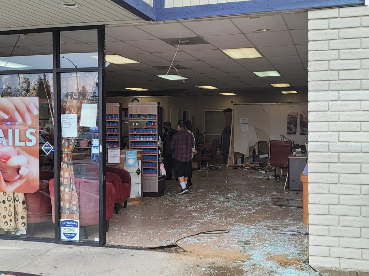 A car crashed into Paradise Nails and Spa in northwest Fresno, California, on Monday.