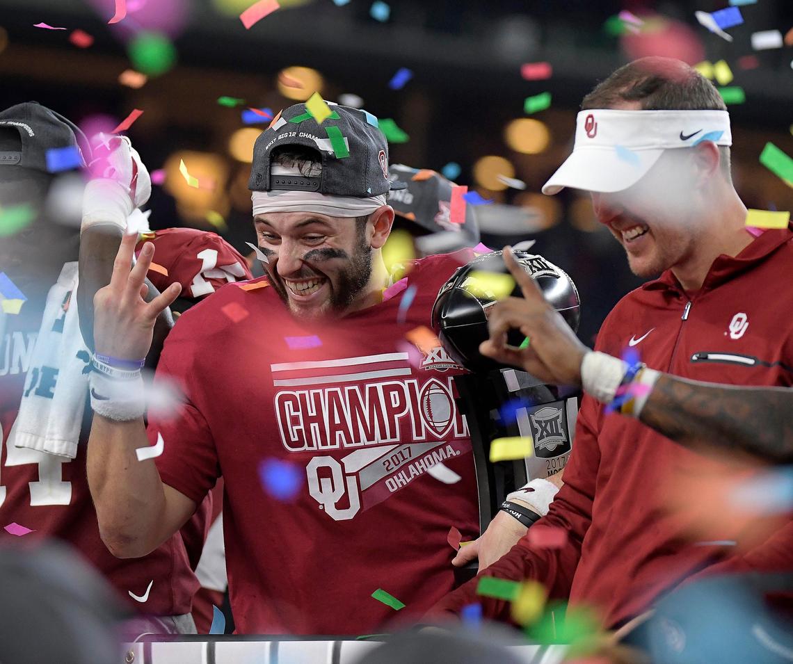 Oklahoma quarterback Baker Mayfield (6) and coach Lincoln Riley on the award platform after the Sooners beat TCU 41-17 in the Big 12 Football Championship game at AT&T Stadium Saturday, Dec. 2, 2017 in Arlington, Texas.