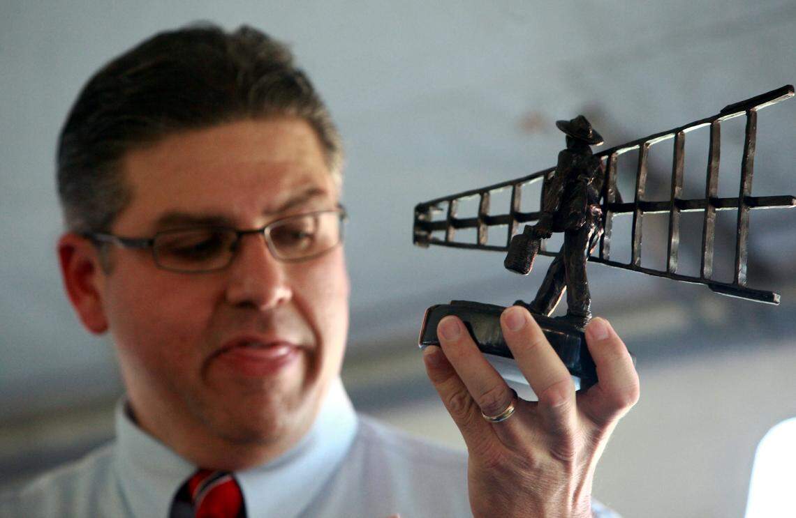 New Fresno State University President Dr. Joseph I. Castro was welcomed in 2013 during a reception hosted by Arte Américas and various other Latino organizations. Castro holds up a sculpture of a farmworker designed by Richard Arenas.