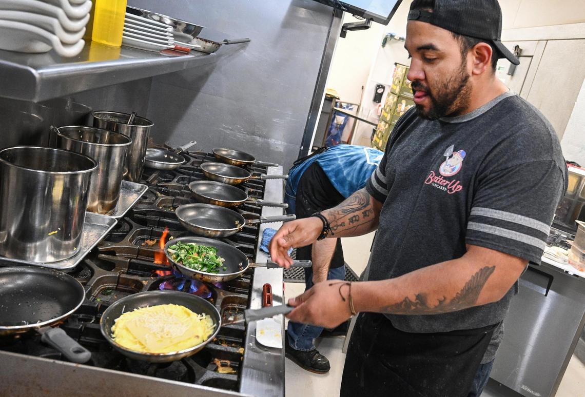 “Kitchen boss” Hector Lopez works on an omelet in the kitchen of the new Batter Up Pancakes location in this file photo from February.