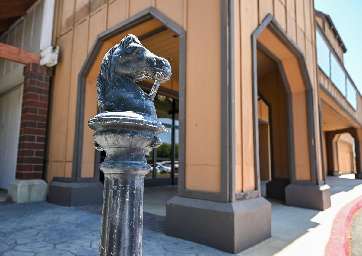 A hitching post stands next to what was the UA Clovis Movies 8 on Villa Avenue near Shaw Avenue in Clovis on Monday, July 7, 2025.