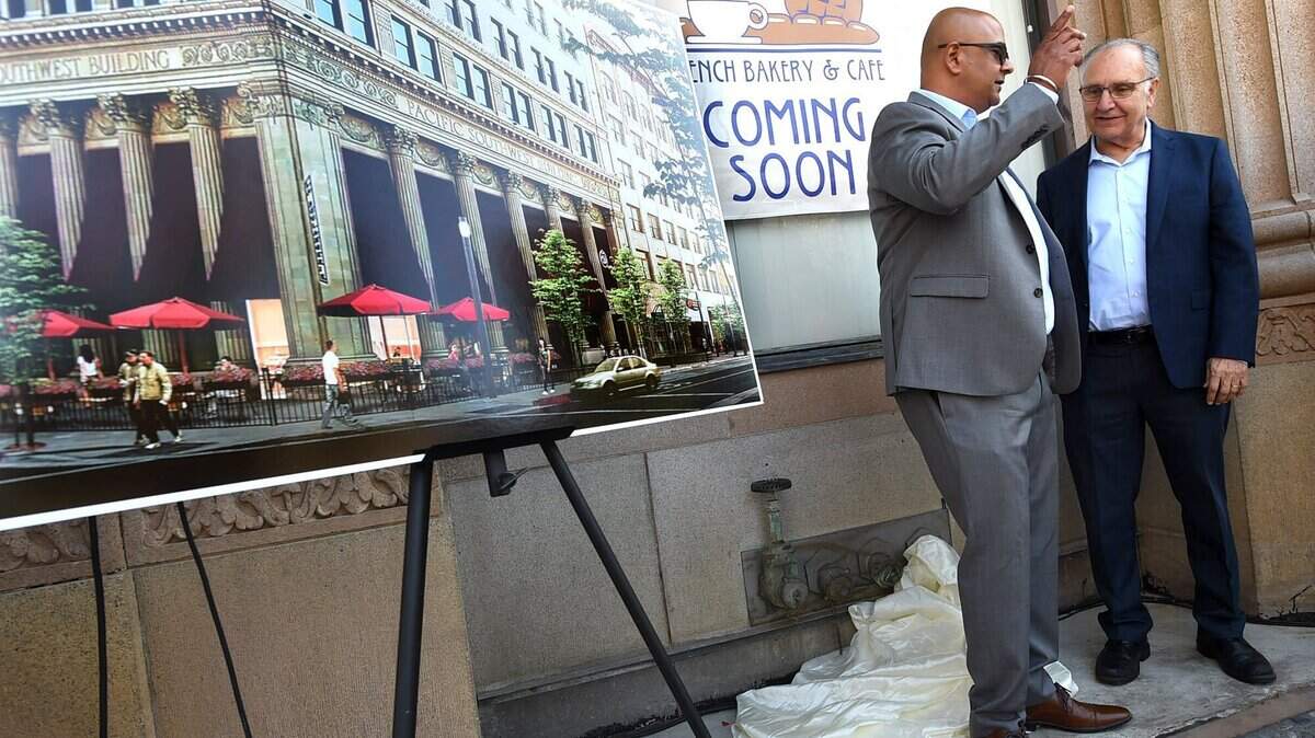 La Boulangerie is gearing up to open its second location, a walk-up window in downtown Fresno. Mayor Lee Brand, far right, talks with a La Boulangerie co-owner in this Fresno Bee file photo after a 2018 event announcing the location.