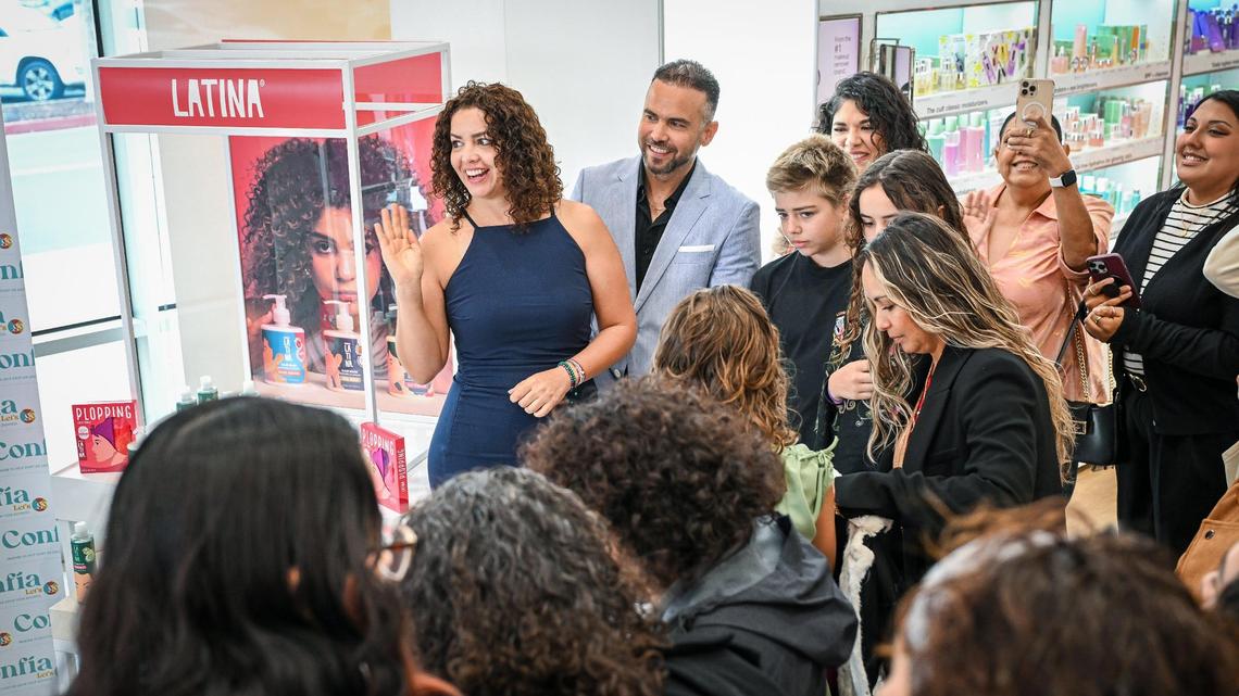 Pilar García Bonilla, top left, stands with her brother and business partner Victor García Bonilla as friends, family and other supporters await the official launch of Pilar’s line of haircare products called Latina in the U.S. at Ulta Beauty in Fresno on Friday, April 25, 2025.