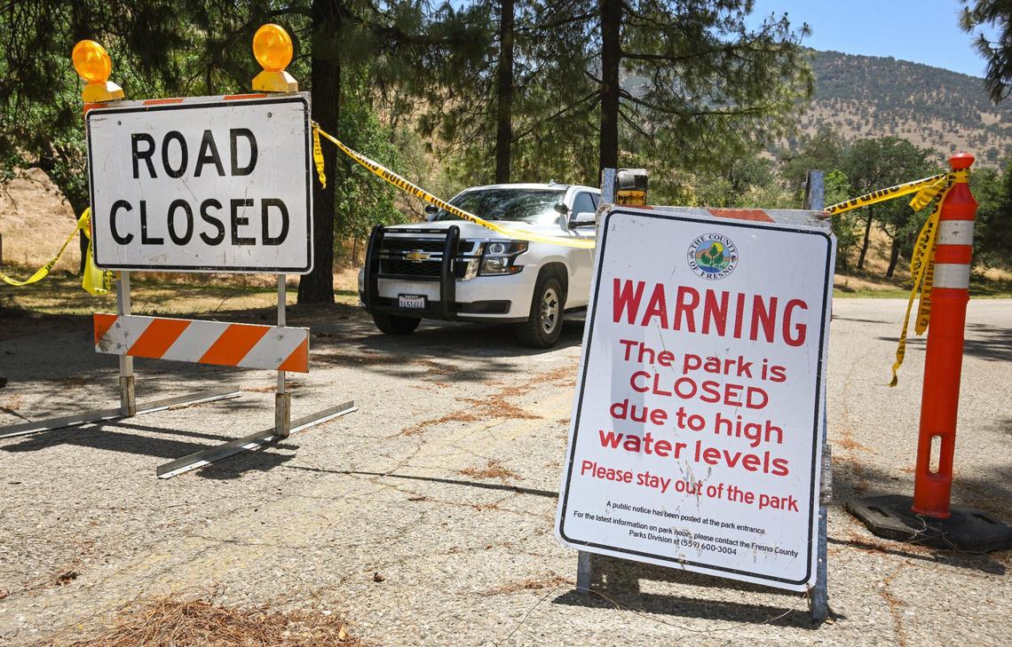 Signs alert people that Choinumni Park on the Kings River is closed due to high water levels, on Monday, May 22, 2023. The Fresno County Sheriff’s Office has closed all access to the Kings River due to dangerously high water levels. A 4-year-old boy and his 8-year-old sister drowned in the river after falling in over the weekend.