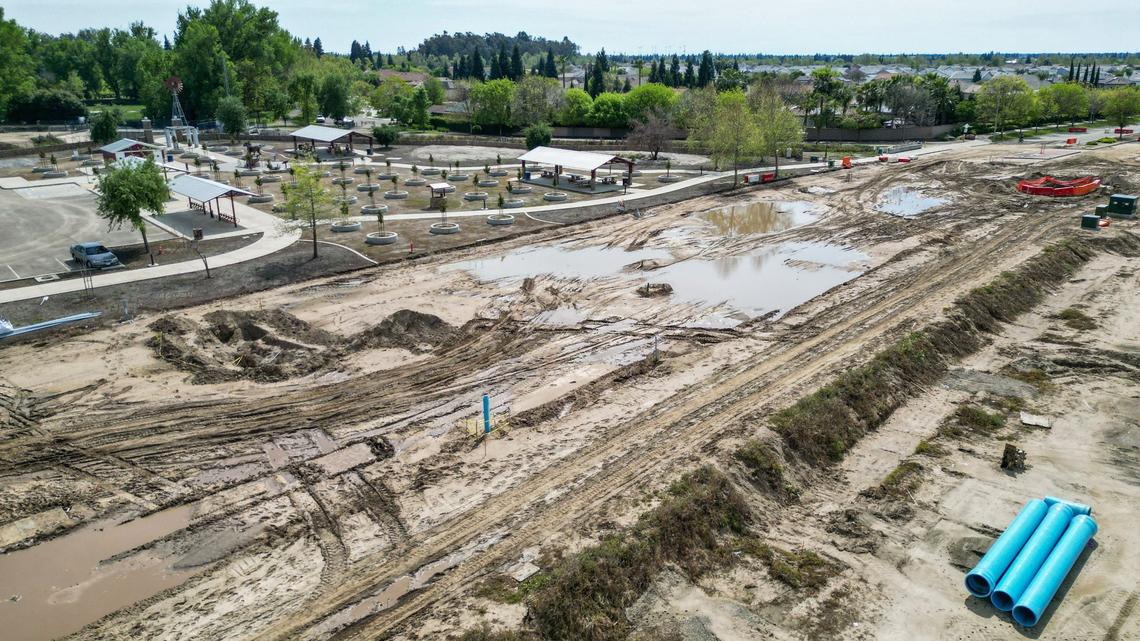 A muddy construction area is shown in this drone image at the intersection of Sunnyside and Shepherd near the Dry Creek trailhead in Clovis on Wednesday, April 17, 2024. The roads in that area have been closed since Jan. 1 for road widening and underground utilities work related to housing construction in the Heritage Grove growth area. Now city officials say it won’t reopen until the end of June.