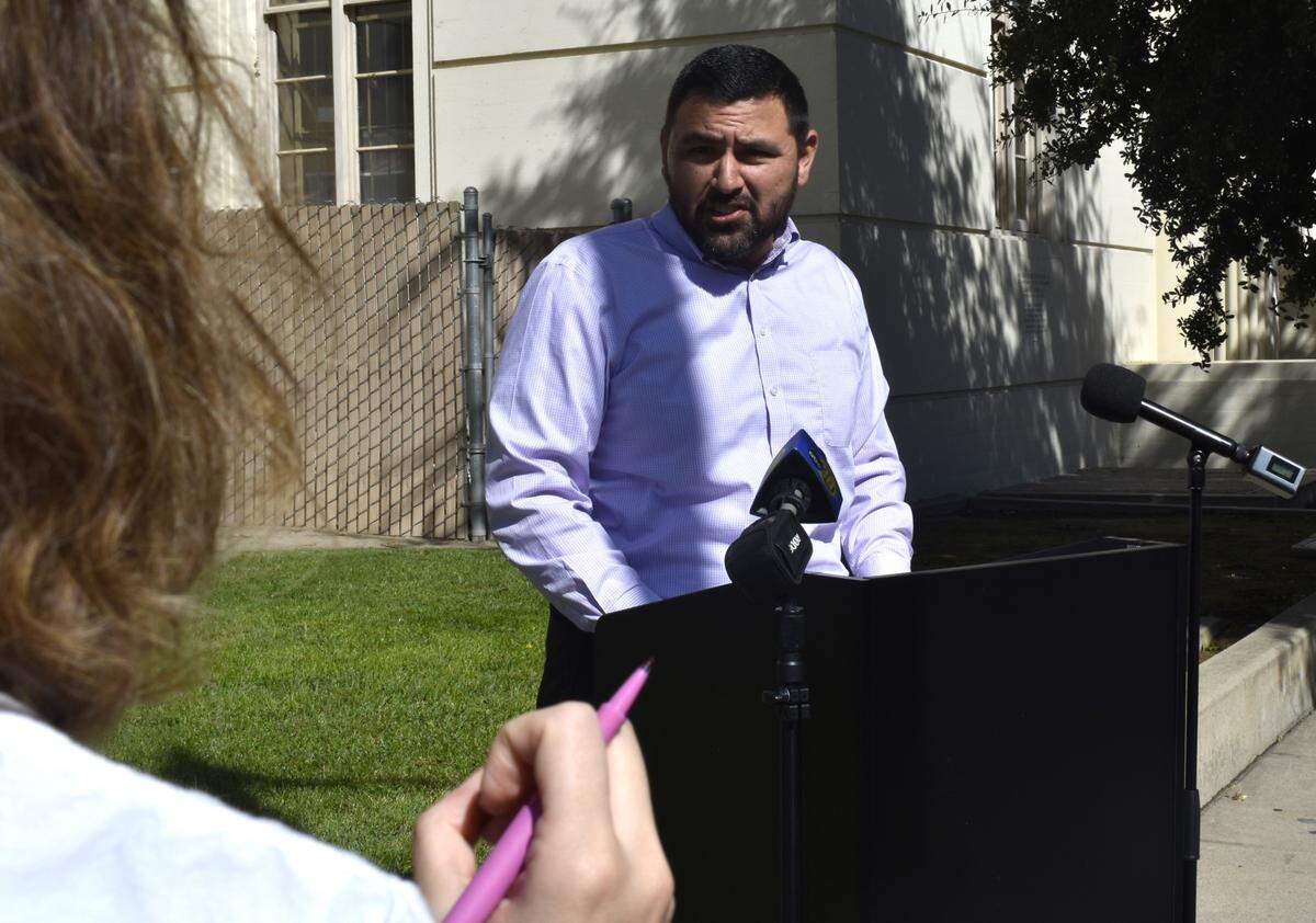 Manuel Bonilla, president of the Fresno Teachers Association, speaks to news reporters about the union’s disagreement with Fresno Unified School District outside of the district’s offices in downtown Fresno on Friday, Oct. 13, 2023.