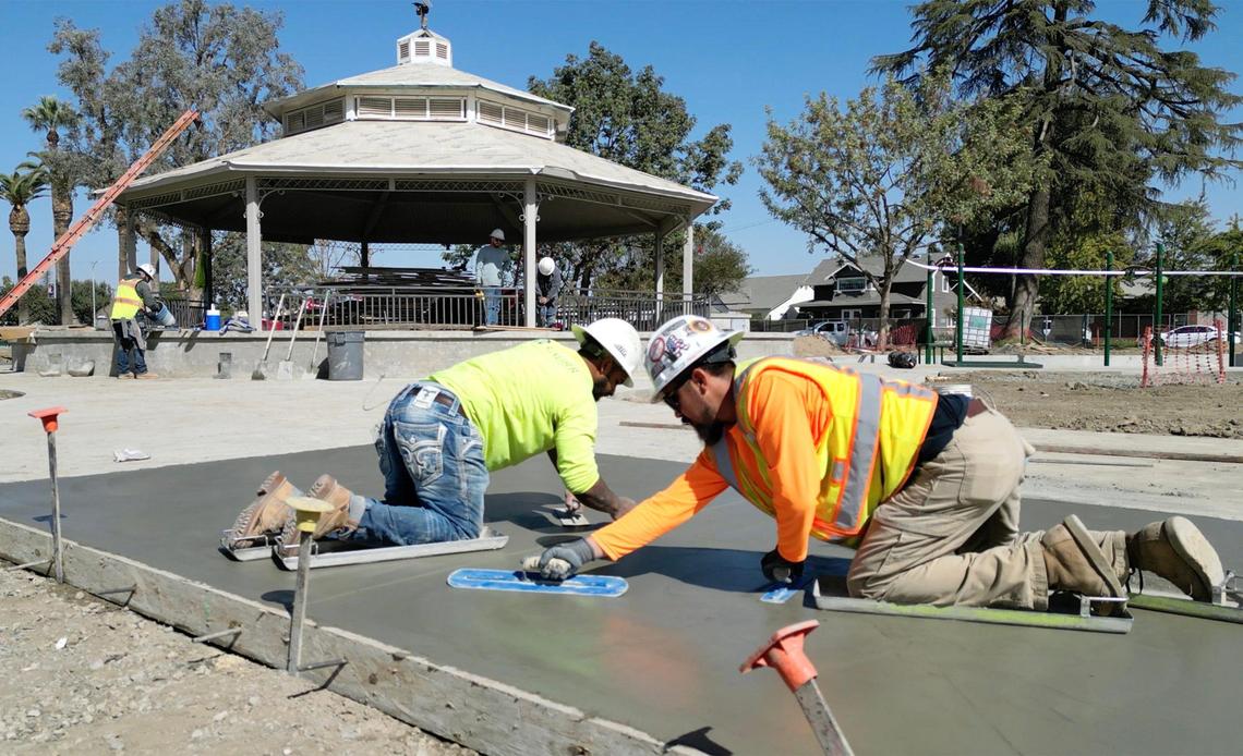 Workers float concrete work as construction continues at the new Adventist Health Amphitheater in central Tulare. Photographed Friday, Oct. 18, 2024.
