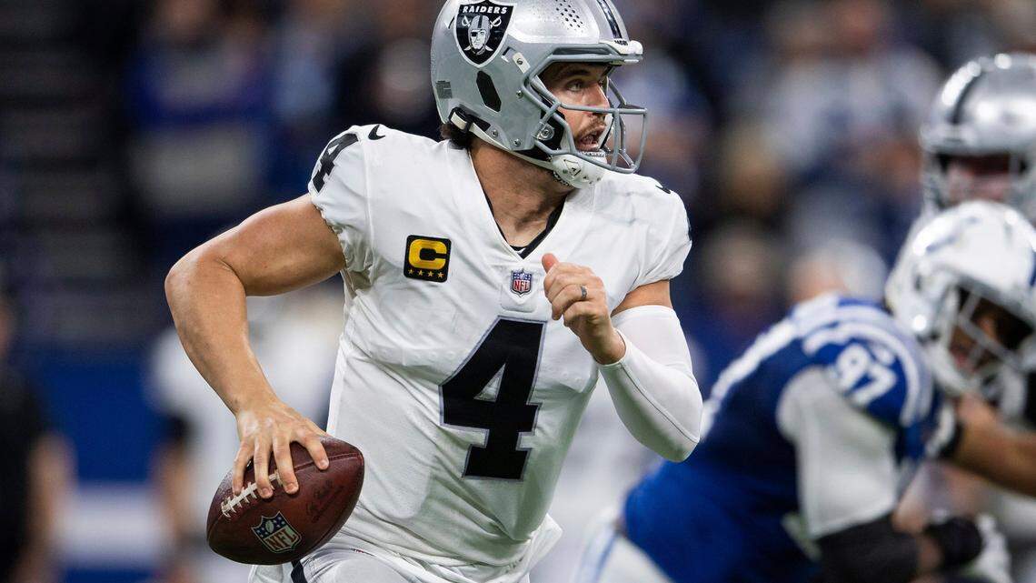 Las Vegas Raiders quarterback Derek Carr scrambles to the sidelines during an NFL game against the Indianapolis Colts, Sunday, Jan. 2, 2022, in Indianapolis.