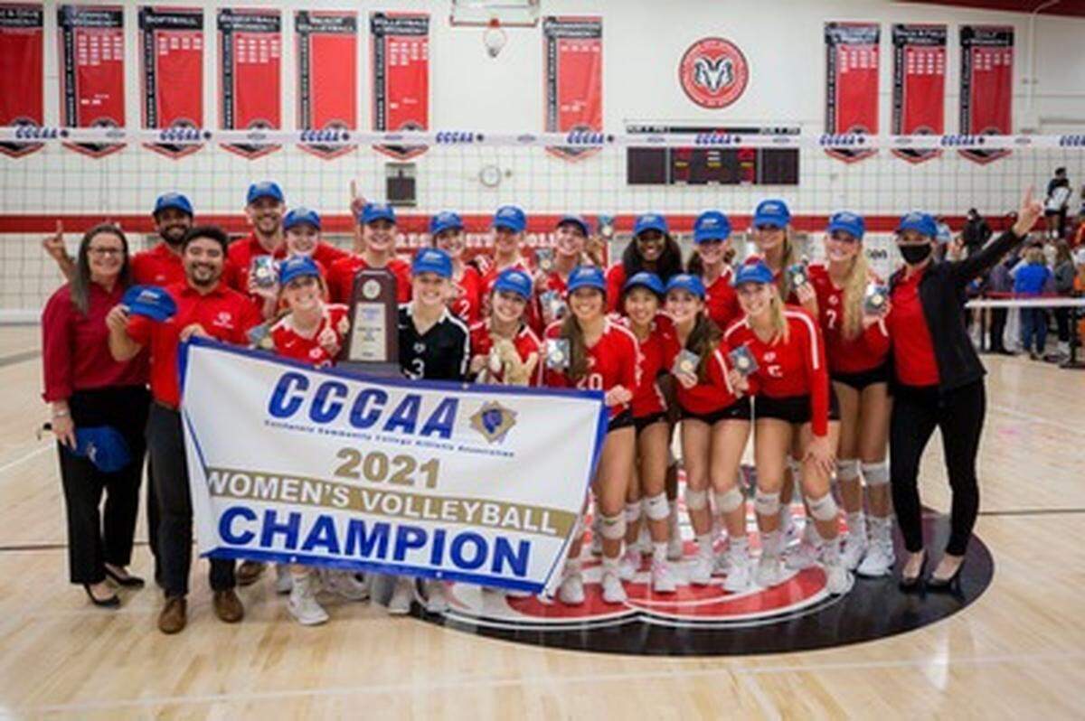 The Fresno City College volleyball team pose for a photo after winning a state title over West Valley on Sunday, Dec. 5, 2021.