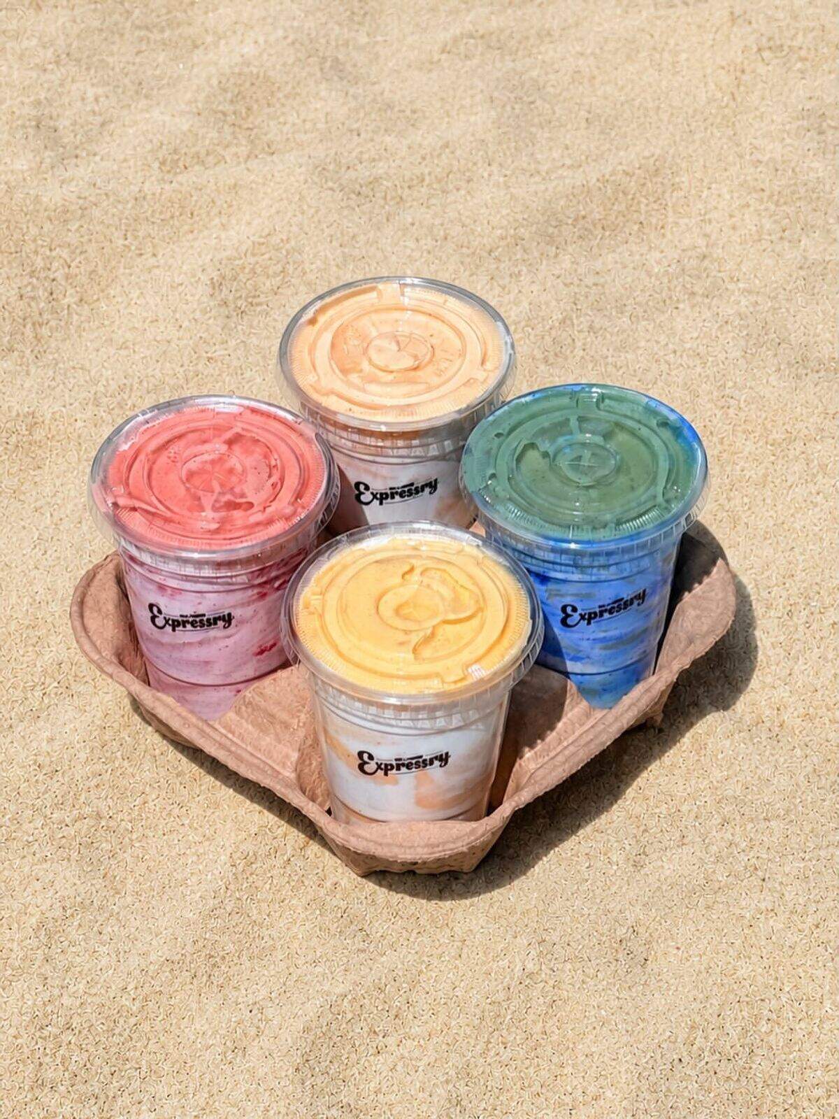 Four smoothies sold by Expressry Deli are on display.