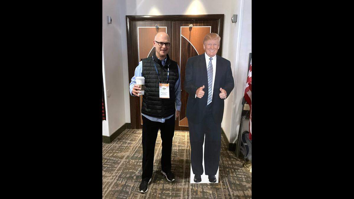 Fresno Bee Opinion Editor Tad Weber stands with the life-size Donald Trump cutout at the California GOP fall convention last year.