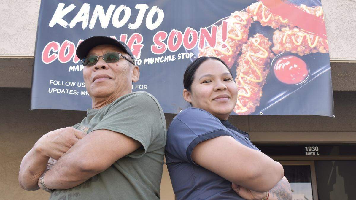 Jilliane Hatsavongsa, right, poses with her father, Bo Liane, left, outside of Kanojo in Madera on Friday, Nov. 10, 2023. The restaurant is currently under construction, but Hatsavongsa plans for a soft opening to take place next month. The restaurant is located at 1930 Howard Road, Suite L.