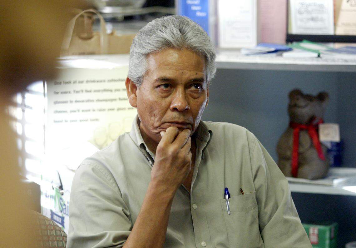 In this Bee file photo from 2007, Augustin Lira watches as his students read lines from The Two Faces of the Boss.