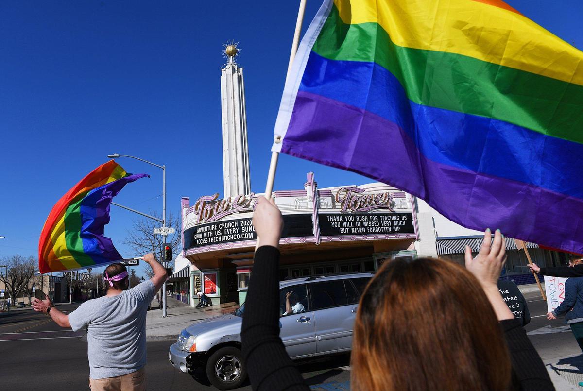 Approximately 100 people gathered across from the Tower Theatre to protest rezoning and the purchase of the theaterby Adventure Church onSunday morning, Feb. 21, 2021 in Fresno.
