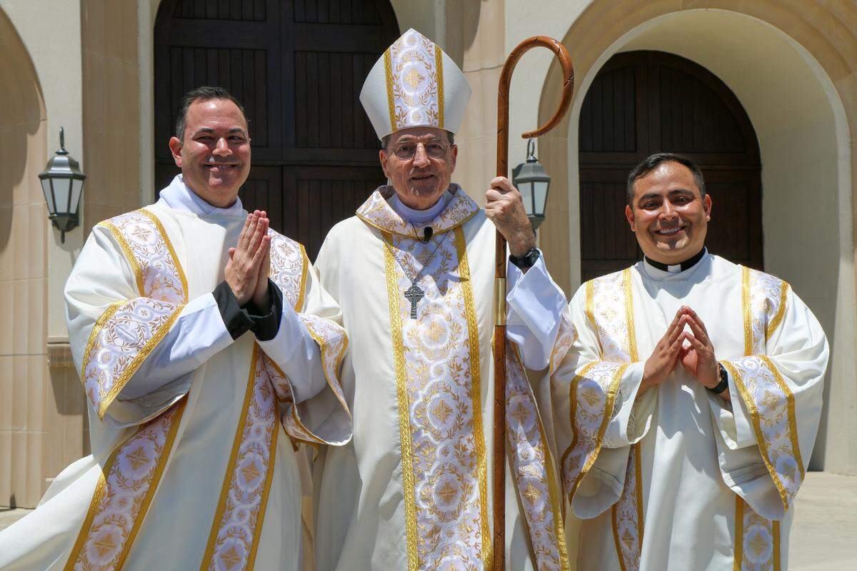 Newly ordained Transitional Deacons Scott Borba, left, and Marco Ayala (right) with Bishop Joseph V. Brennan on June 21, 2025, in Visalia.