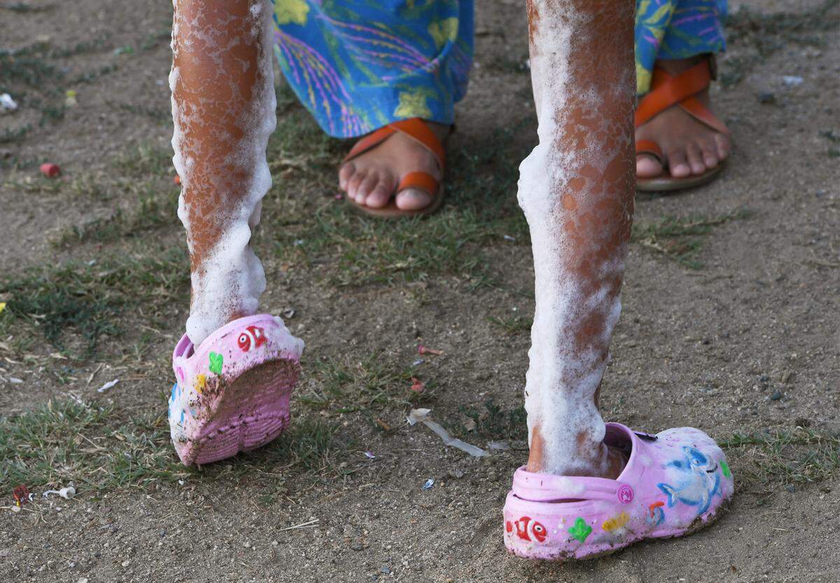 A child taking a break from the foam party Friday, Aug. 19, 2022 in Fresno. Fresno Foam Party, formed in July, is a company that offers a unique and fun foam experience for parties and other gatherings.