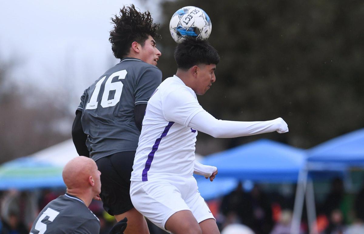 Clovis North’s Brandon Lopez, left, battles for control with Ridgeview’s Chris Chavez Sanchez in the Central Section Boys Division I soccer championship Saturday, Feb. 25, 2023 in Clovis.
