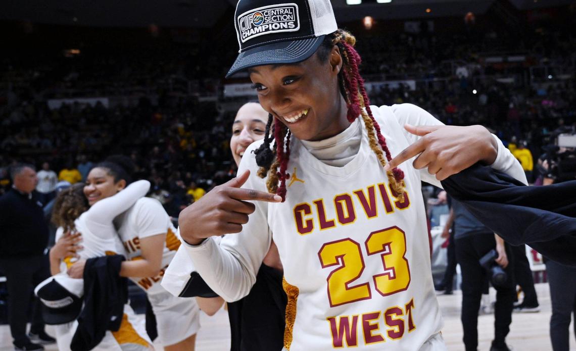 Clovis West’s Etoyah Montgomery, right, celebrates the team’s 54-42 win over Clovis High for the Central Section girls Division I basketball championship Saturday, Feb. 25, 2023 in Fresno.