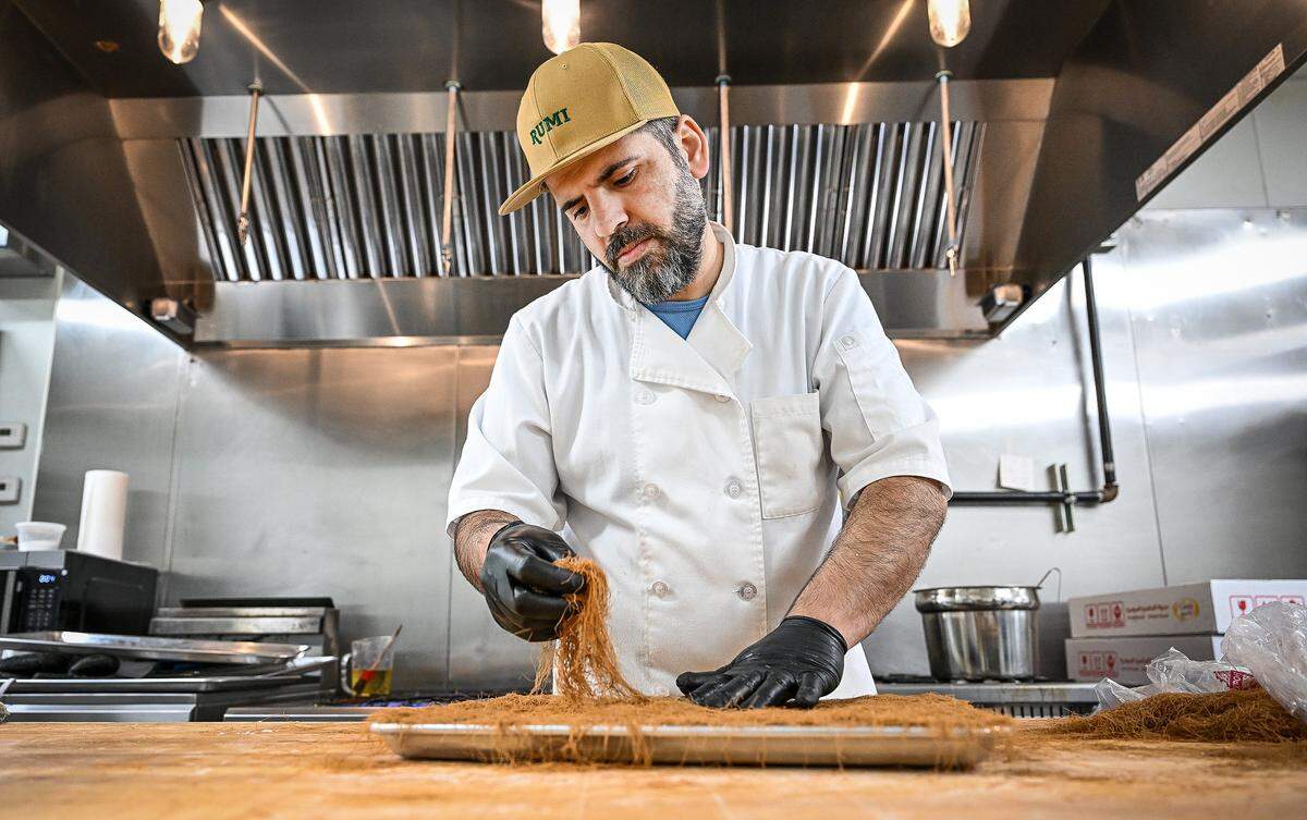 Chef Anas Hamad works on pastries at Rumi Baklava, a new bakery on West Shaw Avenue at Marks in Fresno.