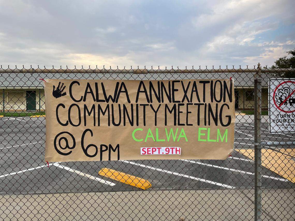 A poster outside of Calwa Elementary School announces a meeting regarding the potential annexation of a portion of the county island of Calwa by the city of Fresno. The community meeting was hosted by nonprofit organizations Friends of Calwa and Fresno Building Healthy Communities on Friday, Sept. 8, 2022.