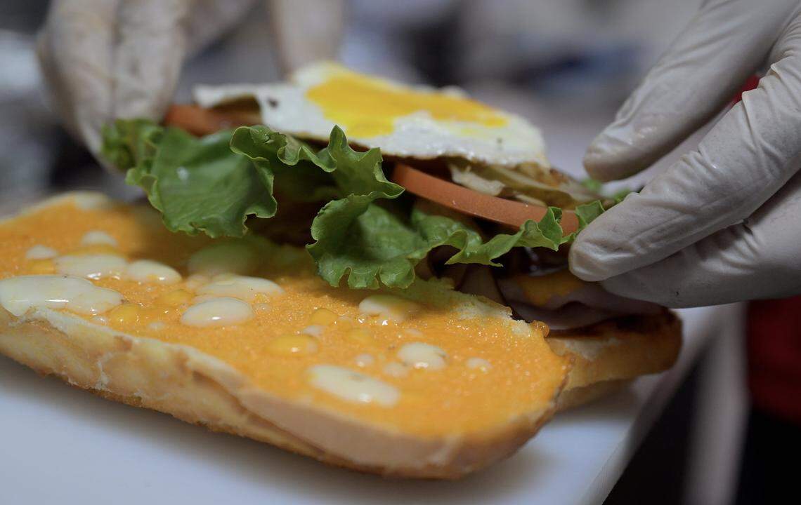 A sandwich with an egg is created at Sanjay Gadh and his wife Renu Arora's Focaccia, serving cold, hot and panni sandwiches and salads. Photographed Thursday, Sept. 18, 2025 in Fresno.