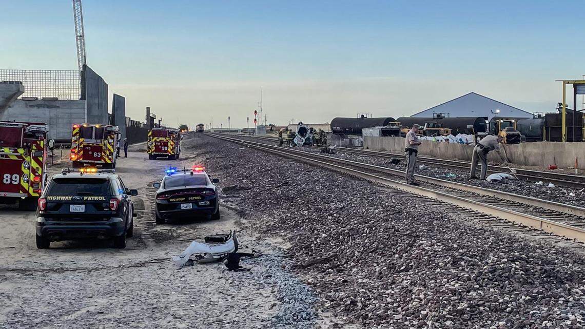 California Highway Patrol officers investigate a fatal crash involving an Amtrak train and a car east of Caruthers.