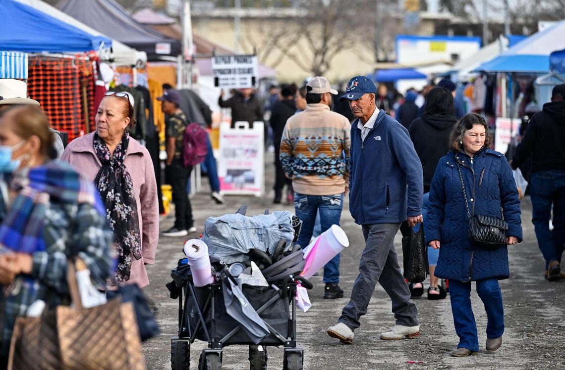 Shoppers stroll the rows of vendors at the busy Fresno Flea Market Sunday Feb. 16, 2025 in Fresno.