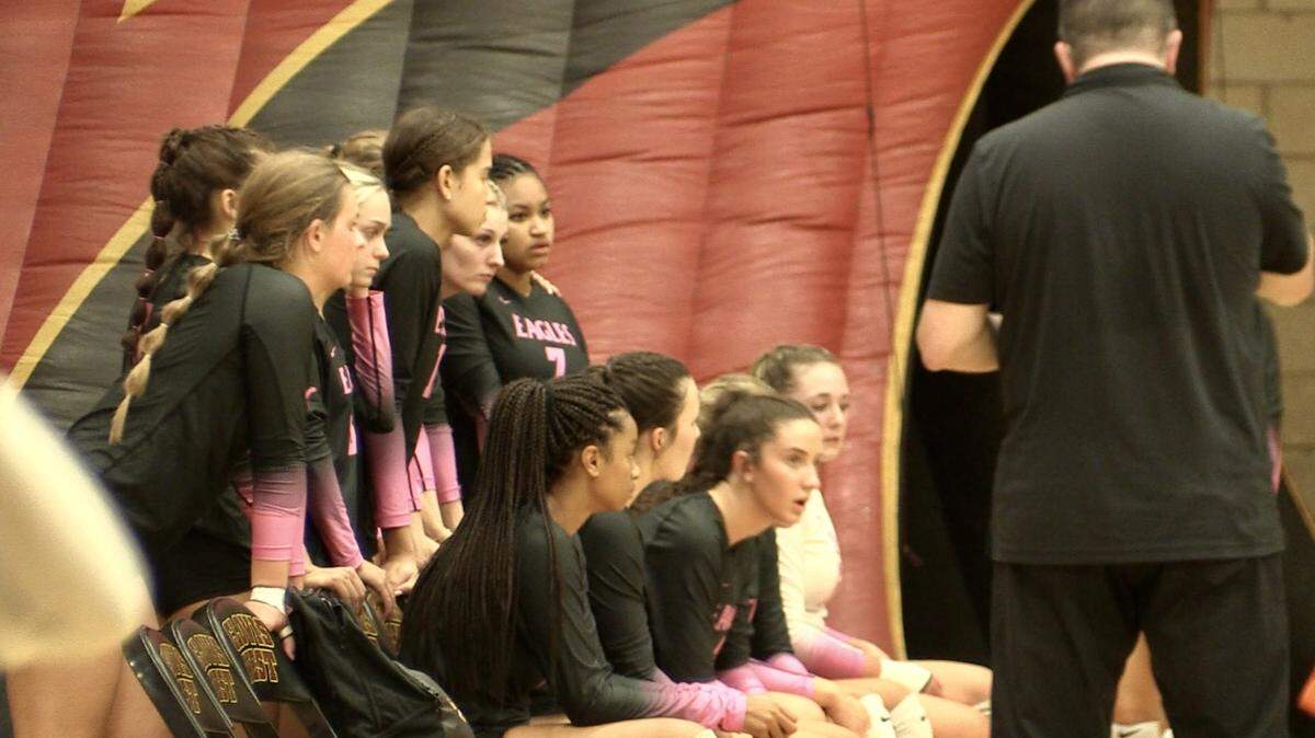 The Clovis West volleyball team discuss strategy during its match against Liberty-Bakersfield on Thursday, Aug. 24, 2023.
