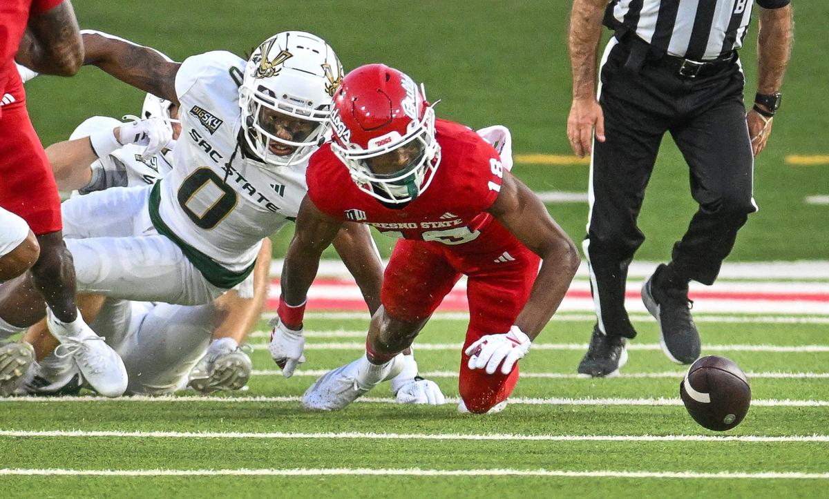 Fresno State’s Jalen Moss, center, fumbles the ball on a punt during their game against Sacramento State at Valley Children’s Stadium on Saturday, Sept. 7, 2024.