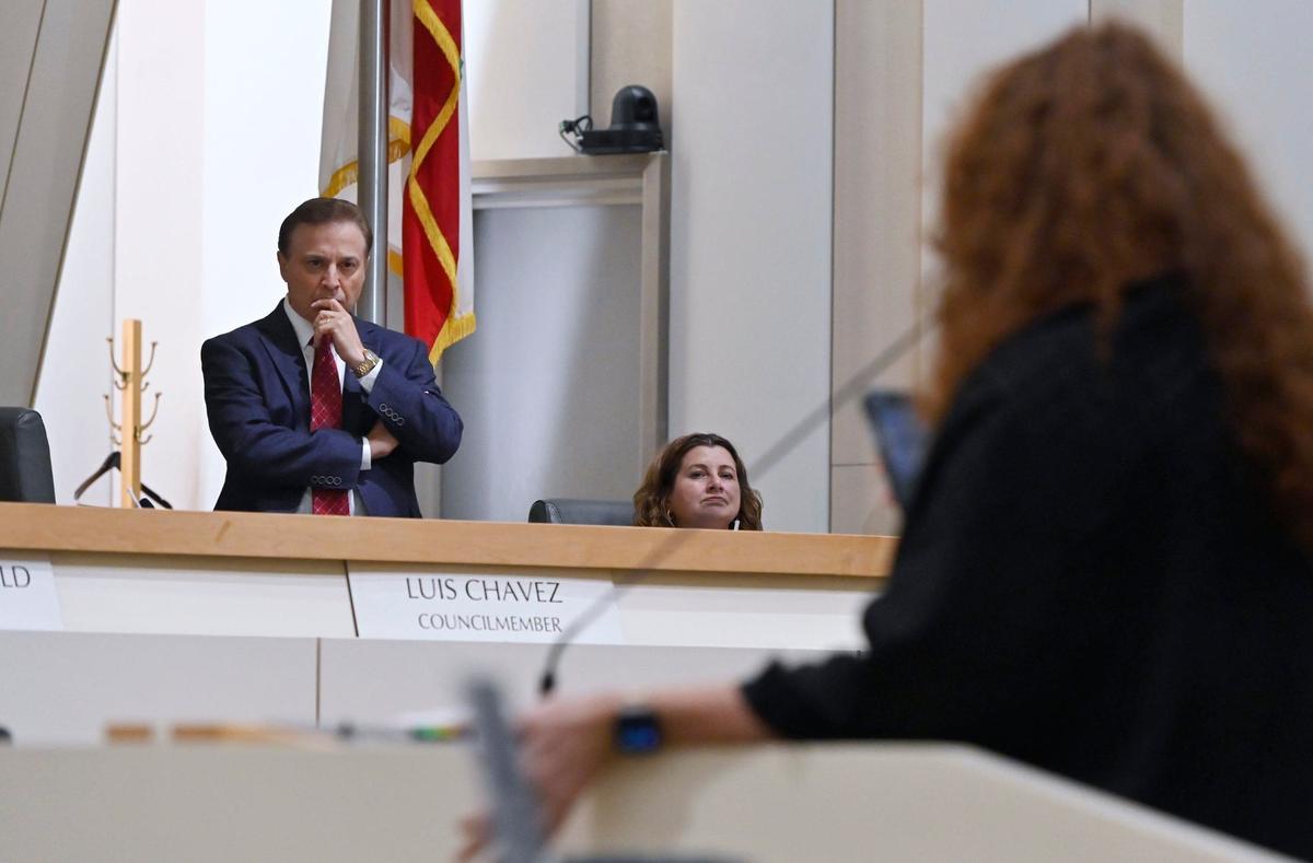 Councilmember Garry Bredefeld stops to listen as a homeless advocate challenges him during an emergency Fresno City Council meeting Monday, July 29, 2024 in Fresno.