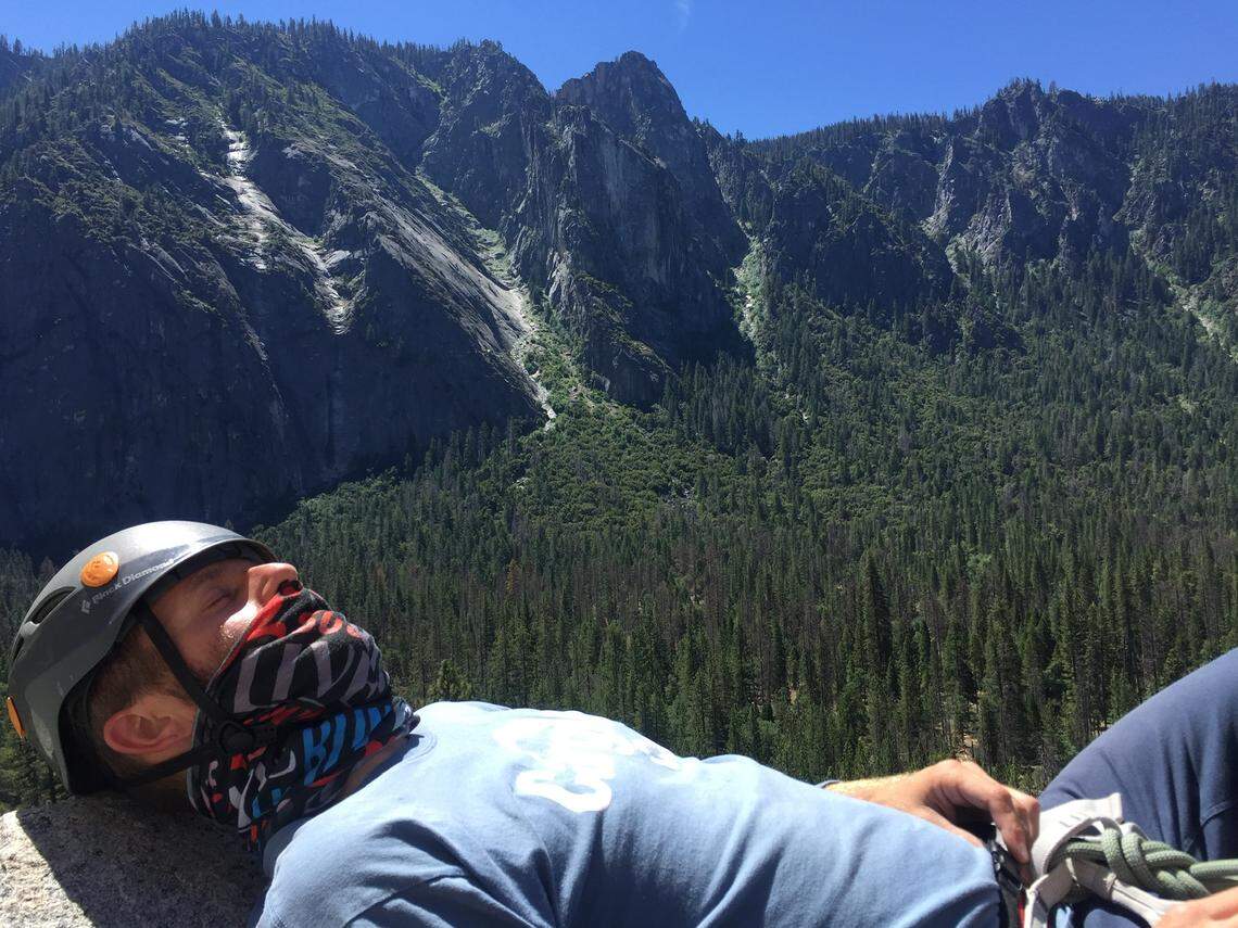 Nicholas Torchia taking a break while rock climbing.