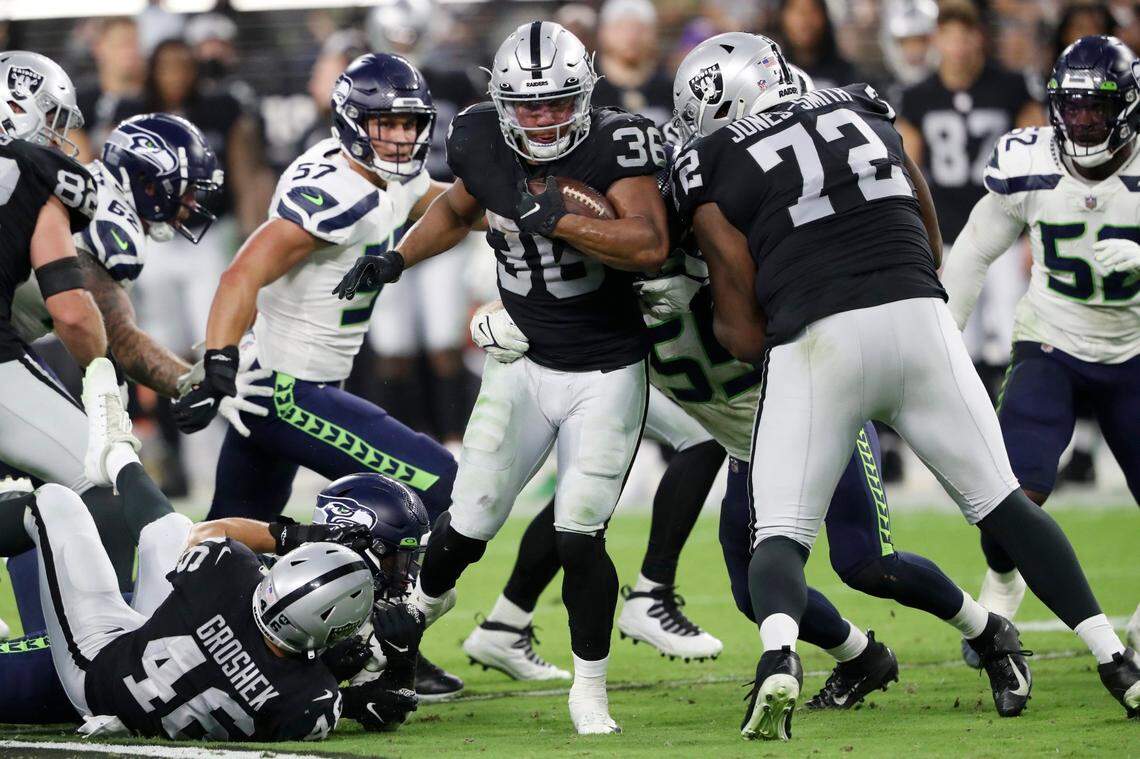 Las Vegas Raiders running back Trey Ragas (36) runs against the Seattle Seahawks during the first half of an NFL preseason football game, Saturday, Aug. 14, 2021, in Las Vegas.