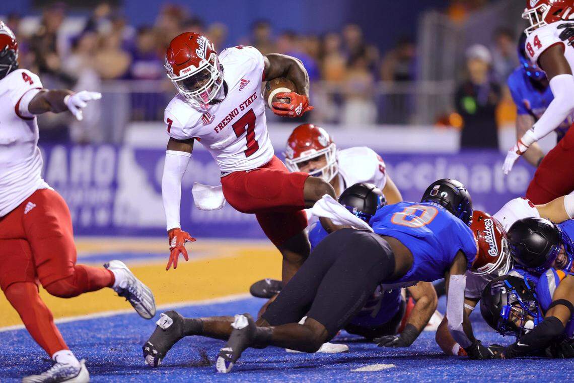 Fresno State running back Jordan Mims (7) spins on a run to the 1-yard line against Boise State during the first half of an NCAA college football game Saturday, Oct. 8, 2022, in Boise, Idaho. (AP Photo/Steve Conner)