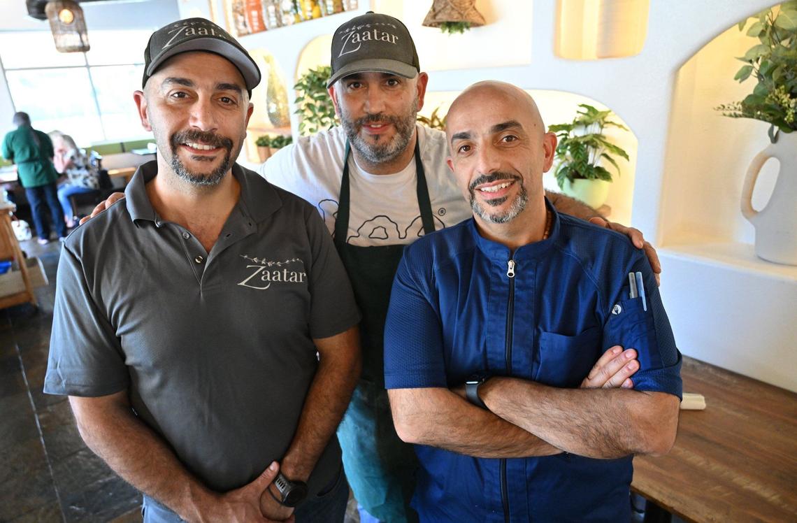 Brothers Roy Nassar, left, Rabih “Robby” Nassar in center, and Badih Nassar, right, have opened Zaatar Bistro in north Fresno’s Via Montana Shopping Center at Shepherd Avenue and Champlain Drive.