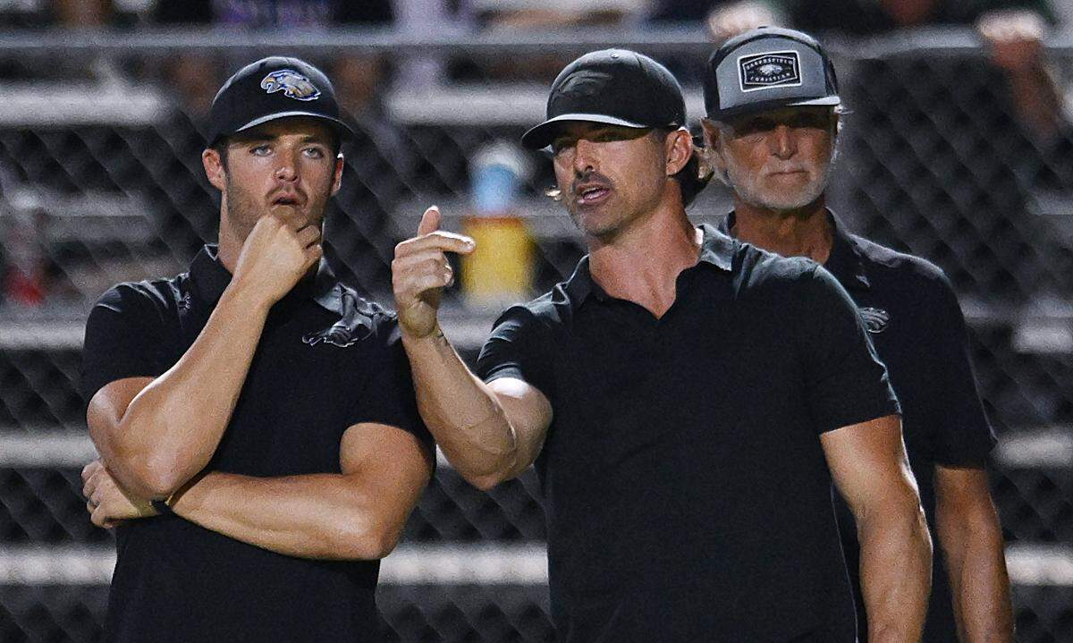 Derek Carr, left, with his brother David Carr to the righ on the Bakersfield Christian's sideline during the game against Tulare Union Friday, Sept. 26, 2025 in Tulare. Bakersfield Christian beat Tulare Union 30-7.