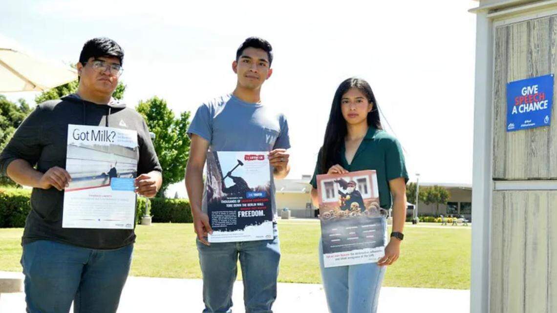 Members of the Young Americans for Freedom chapter at Clovis Community College, from left, Daniel Flores, Alejandro Flores and Juliette Colunga, hold examples of flyers they say were illegally removed from bulletin boards in November 2021. The three and the club filed a federal civil rights lawsuit against college administrators alleging violations of their constitutional right to freedom of expression.